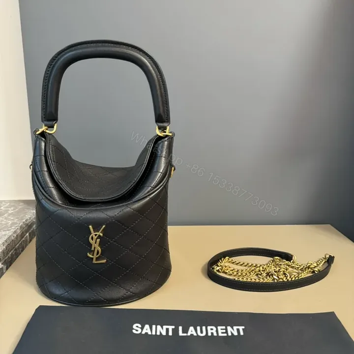 View 1 of Structured Black Quilted Bucket Bag with Gold Accents