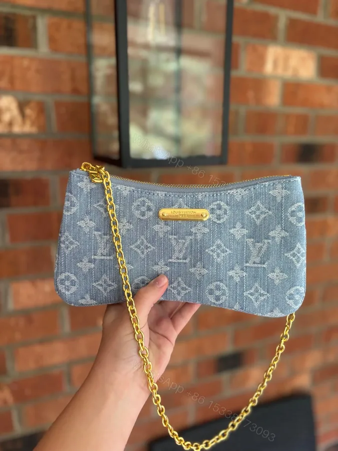 View 1 of Louis Vuitton Liv Pochette in Blue Denim
