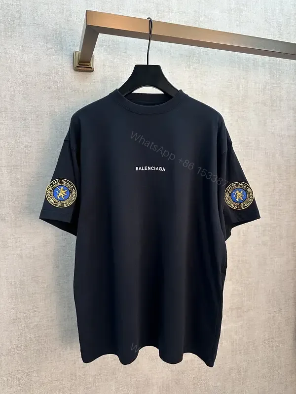 View 1 of Black Cotton Oversized Balenciaga Logo T-Shirt with Crest Patches