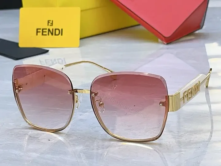 View 1 of Gold Frame Pink Gradient Sunglasses with FENDI Logo