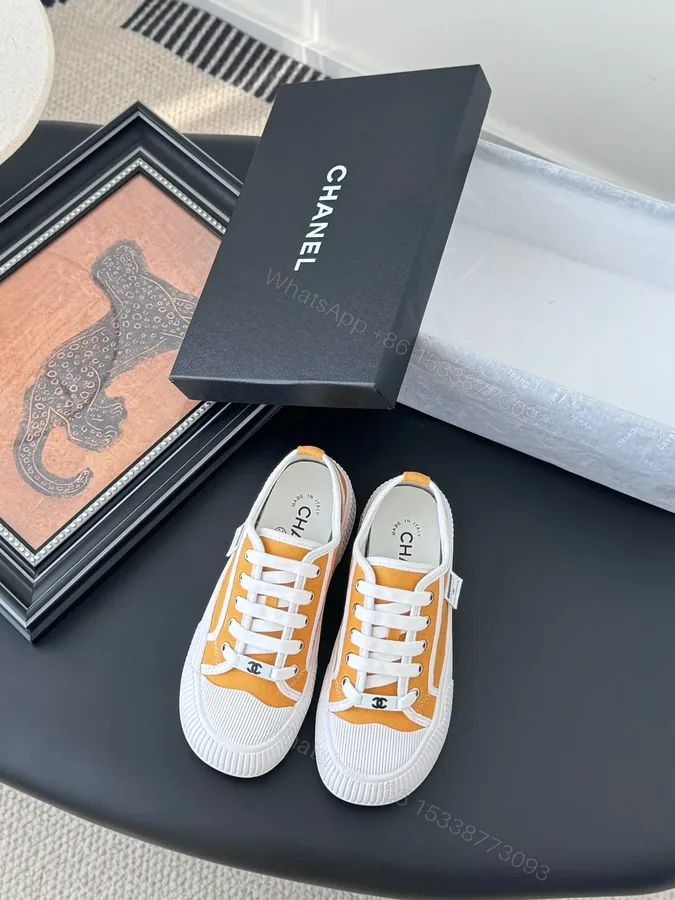 View 1 of Chanel Women Yellow Canvas And Rubber Sneakers