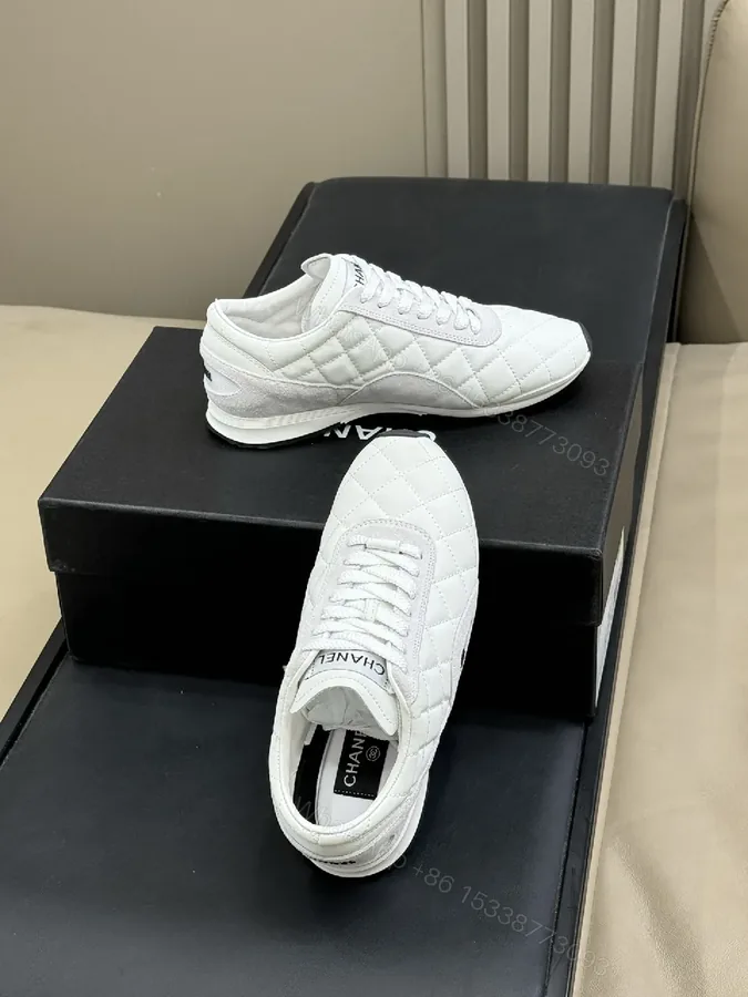 View 1 of White Quilted Leather Low-Top Sneakers with Signature Detailing