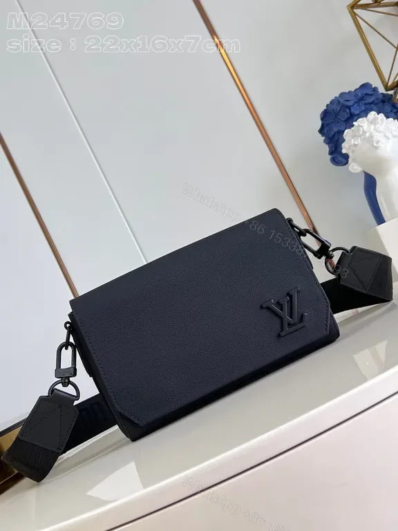 View 1 of Chic Compact Messenger: Luxury Leather, Subtle LV Emblem