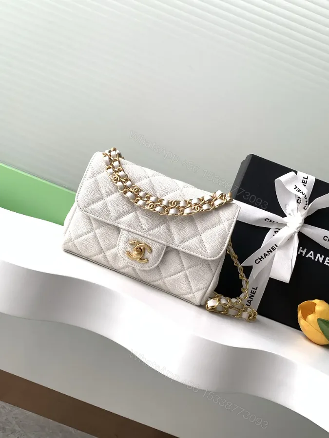 View 1 of Quilted Mini Flap Bag with Gold Chain - Classic Chic Crossbody