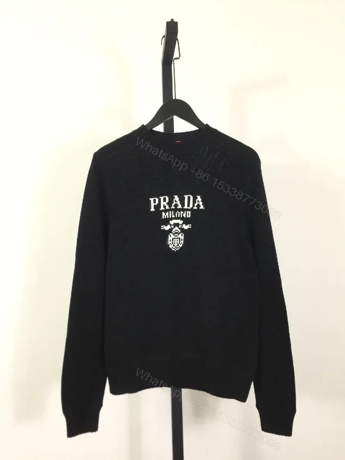 View 1 of Leather-Feel Knit Crewneck with Crest: Subtle Luxury Comfort