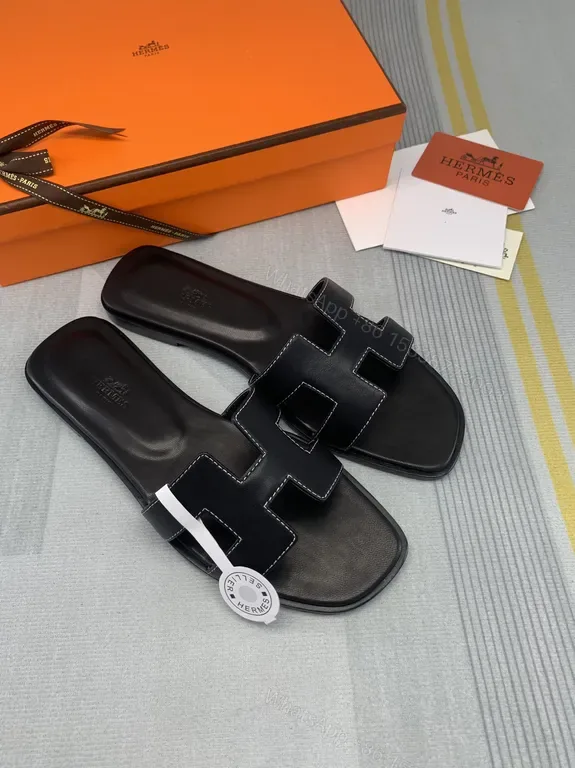 View 1 of HermÃ ̈s Oran Sandals Black Calfskin â€“ Minimalist H-Strap Luxury