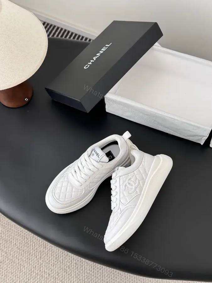 View 1 of White Quilted Low-Top Sneakers — Subtle Couture Comfort