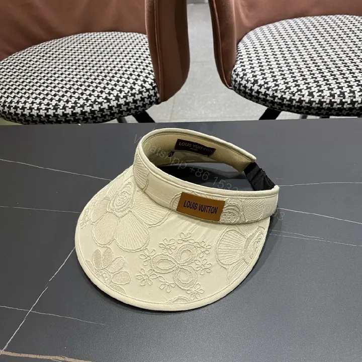 View 1 of Textured Embroidered Visor: Luxury Sun-Ready Accessory