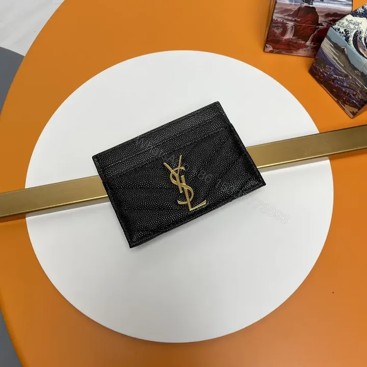 View 1 of Chic Black Textured Leather Wallet with Gold YSL Logo