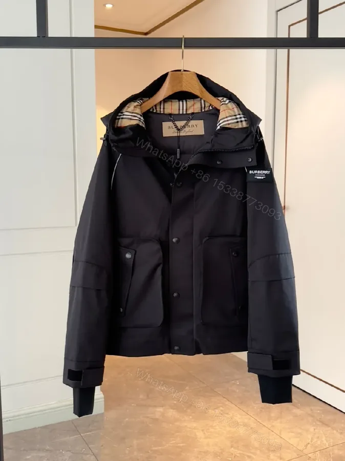 View 1 of Water-Resistant Black Parka with Plaid Lining Luxury-Utility Coat