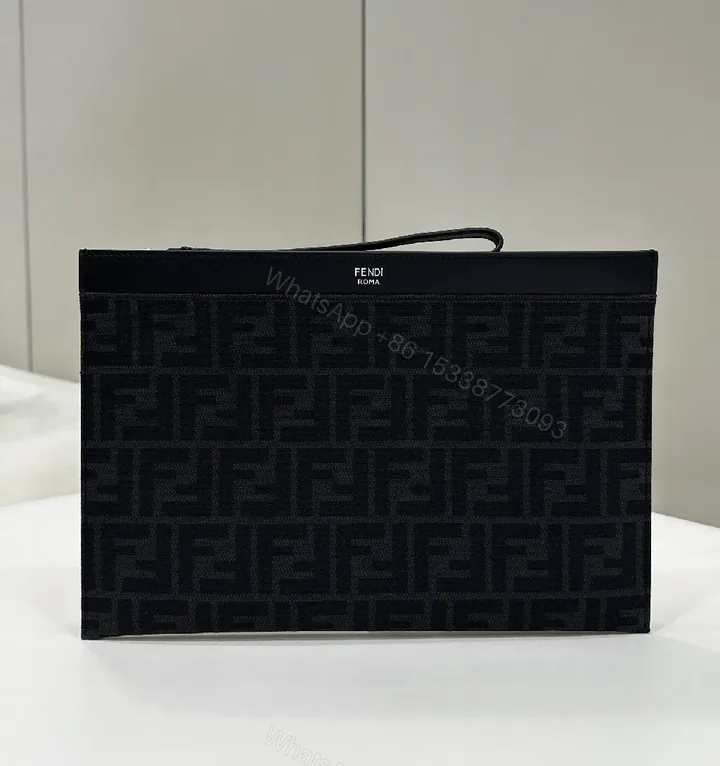 View 1 of Refined Monogram Clutch: Luxe Texture, Everyday Versatility