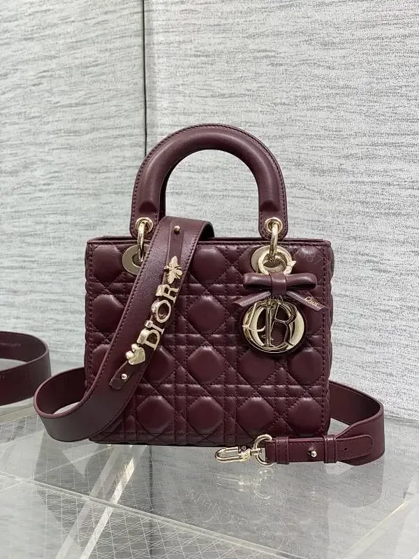 View 1 of Quilted Burgundy Handbag with Top Handles, Structured Charm