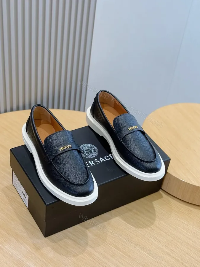 View 1 of Navy Leather Penny Loafers with Gold Hardware & White Sole