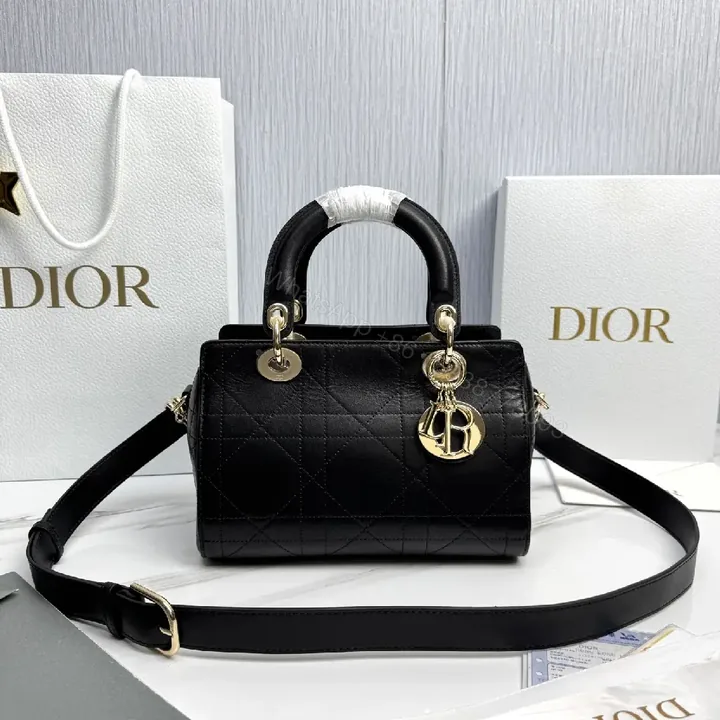 View 1 of Quilted Black Satchel: Gold Charm, Compact Luxury Bag