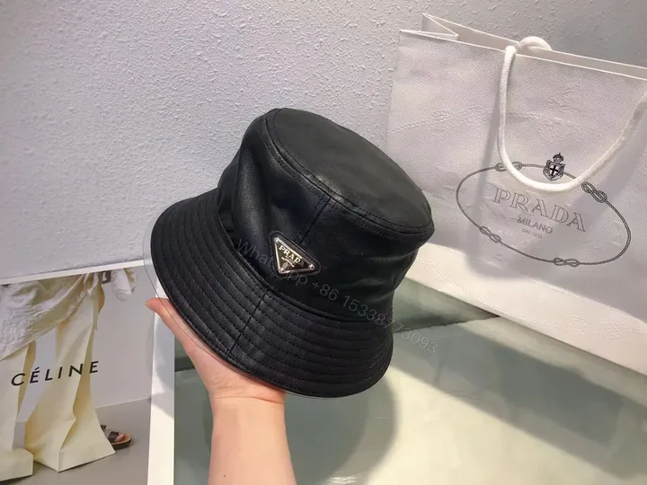 View 1 of Black Leather-Texture Bucket Hat with Prada-Inspired Logo