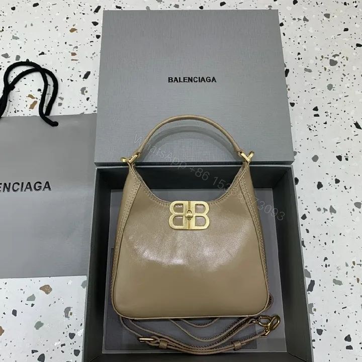 View 1 of Compact Taupe Leather Handbag with Gold Hardware, Crossbody Ready