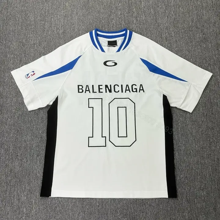 View 1 of Bold Black-White Statement Jersey Tee with Electric Blue Accents