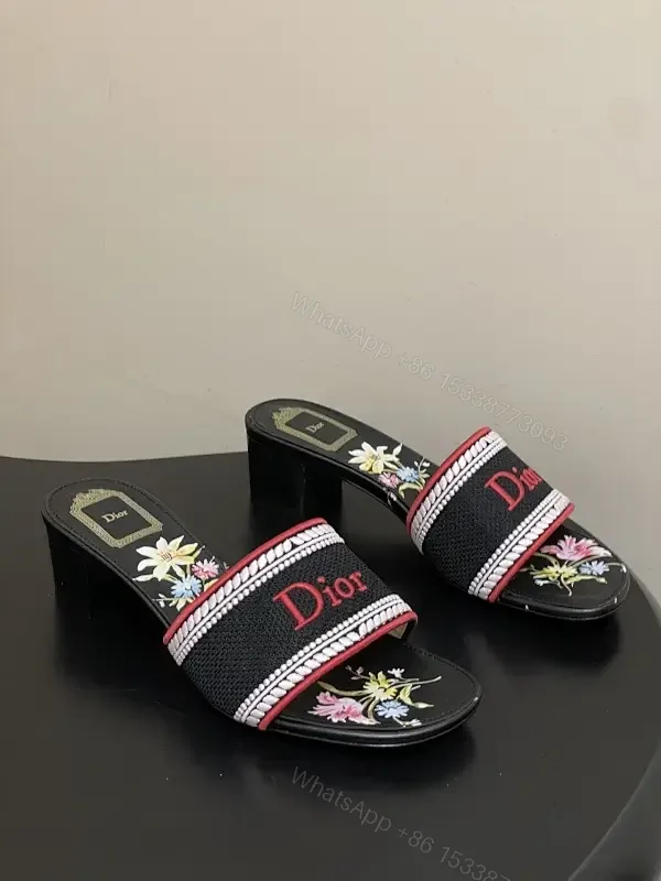 View 1 of Embroidered Slip-Ons with Bold Branding Sandals