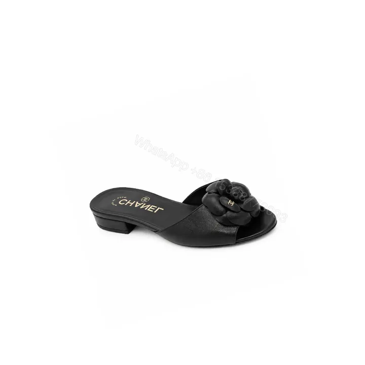 View 1 of Chanel CC Mules With Camellia In Black