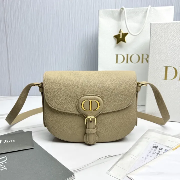 View 1 of Beige Pebbled Leather Saddle Bag — Subtle Texture, Versatile Comfort