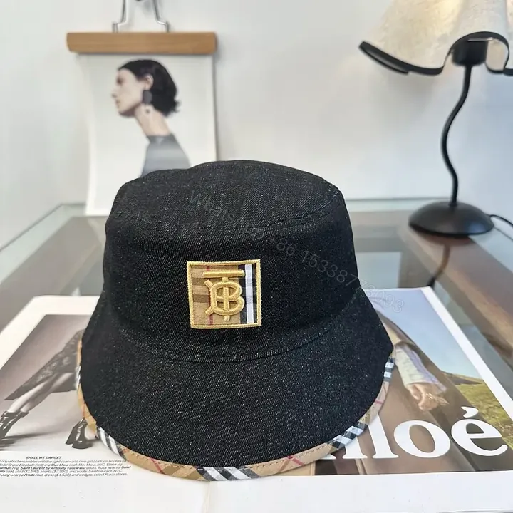 View 1 of Dark Black Denim Bucket Hat with Burberry-Style Band and Gold Emblem
