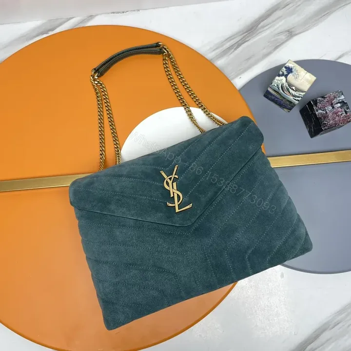 View 1 of Chic Teal Suede Quilted Shoulder Bag with Gold Monogram