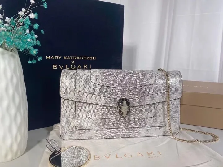 View 1 of Statement Metallic Handbag: BVLGARI x Katrantzou Bracelet Clasp Crossbody
