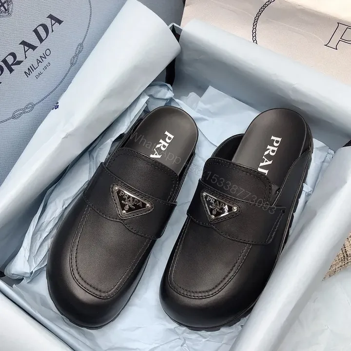 View 1 of Prada Black Leather Loafers â€” Signature Logo, Everyday Sophistication
