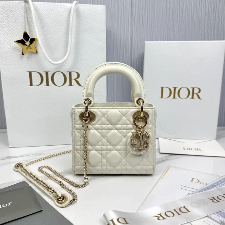 View 1 of Ivory Quilted Mini Handbag with Chain and Charms - Luxury Style