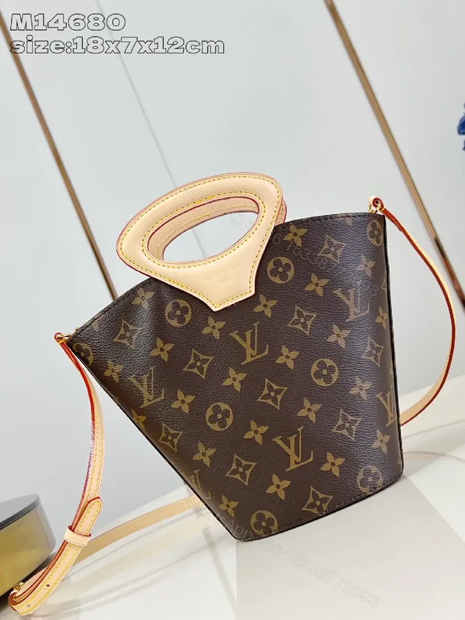 View 1 of Monogram Canvas Bag: Sculpted Top Handle, Everyday Luxury