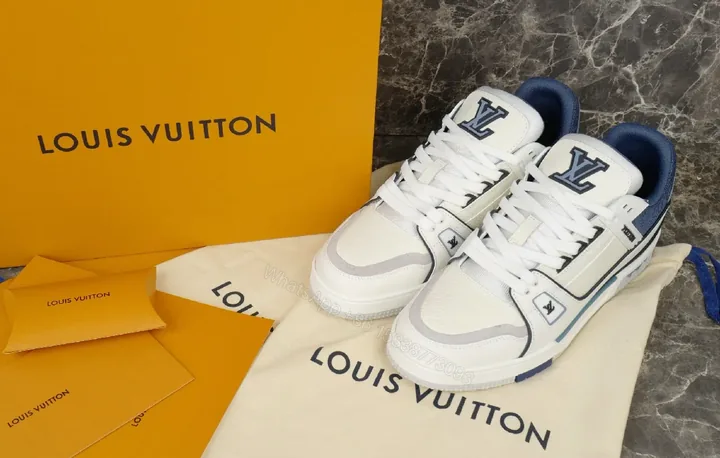 View 1 of Bright White Navy Lux Sneaker: Modern Comfort & Subtle LV-Inspired Details