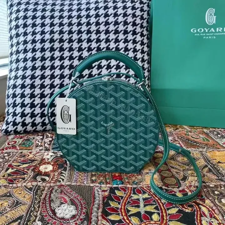 View 1 of Teal Goyardine Round Crossbody: Chic, All-Day Versatility