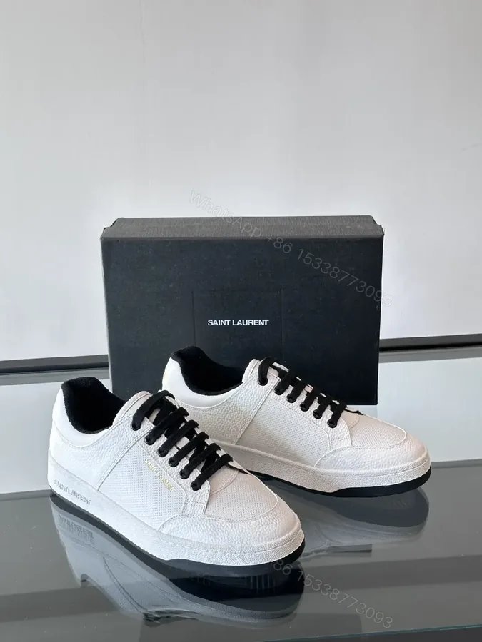 View 1 of White Leather Sneaker with Black Accents — Minimalist Luxury Sneaker