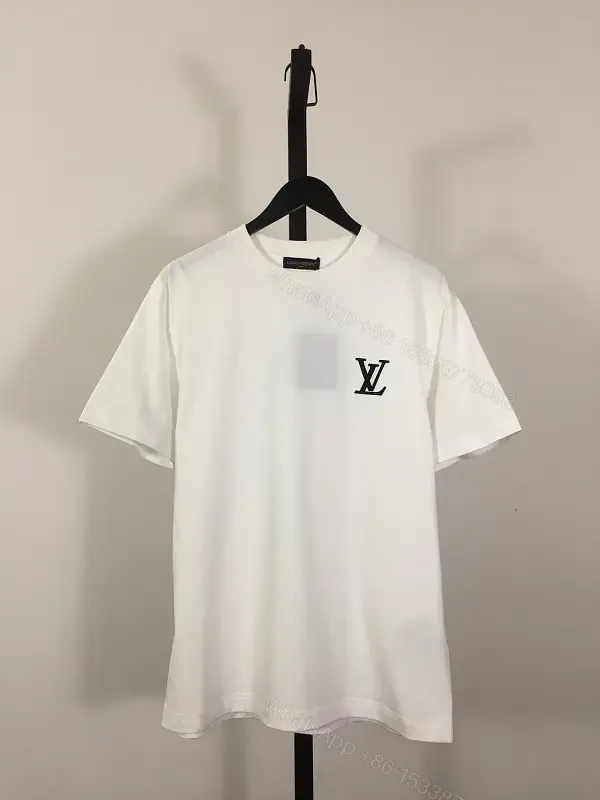 View 1 of Classic White Tee - Premium Cotton, Subtle Emblem, Everyday Luxe