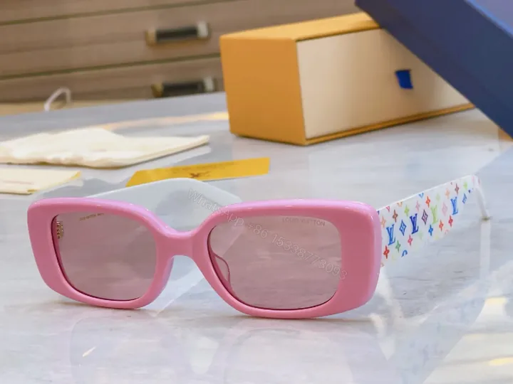 View 1 of Pink Frame Sunglasses with Multicolor Strap — Bold Luxury Sunnies