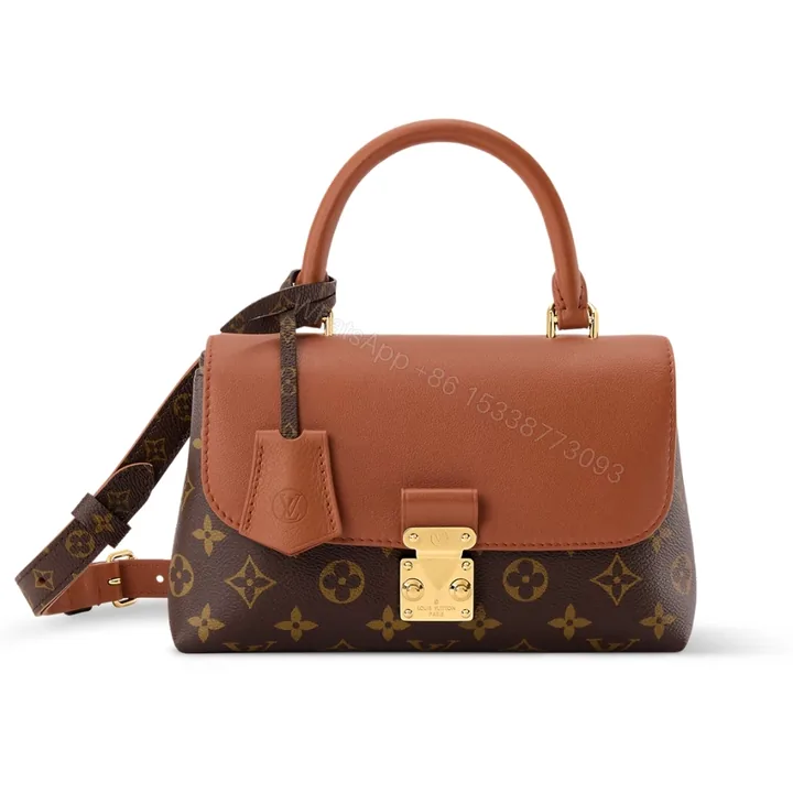 View 1 of Louis Vuitton Madeleine BB Monogram Cognac 24Cm M28288