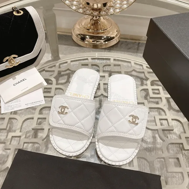 View 1 of White Quilted Slides with Gold Logo â€“ Couture-Inspired Sandals