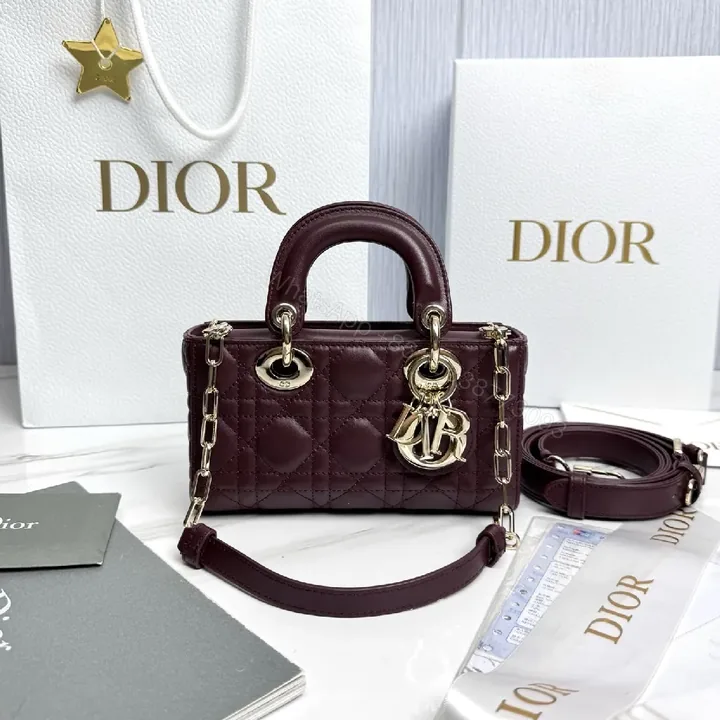 View 1 of Quilted Burgundy Calfskin Top-Handle Bag with Gold Accents