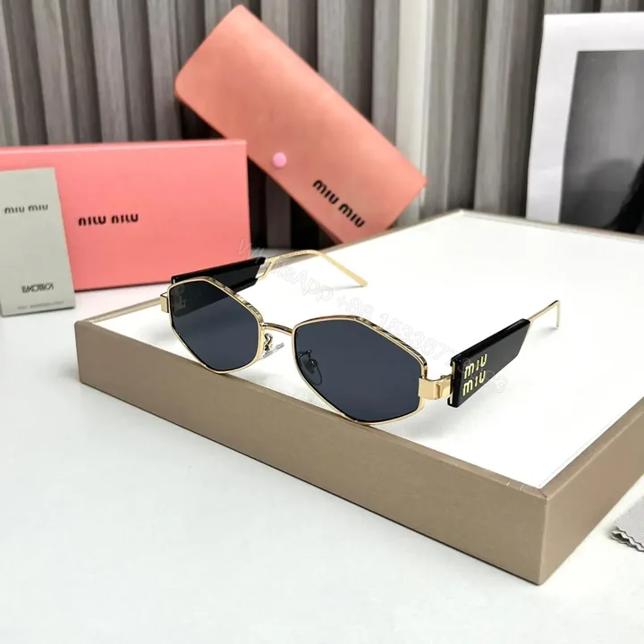 View 1 of Miu Miu Hexagon Black-Gold Sunglasses Universal