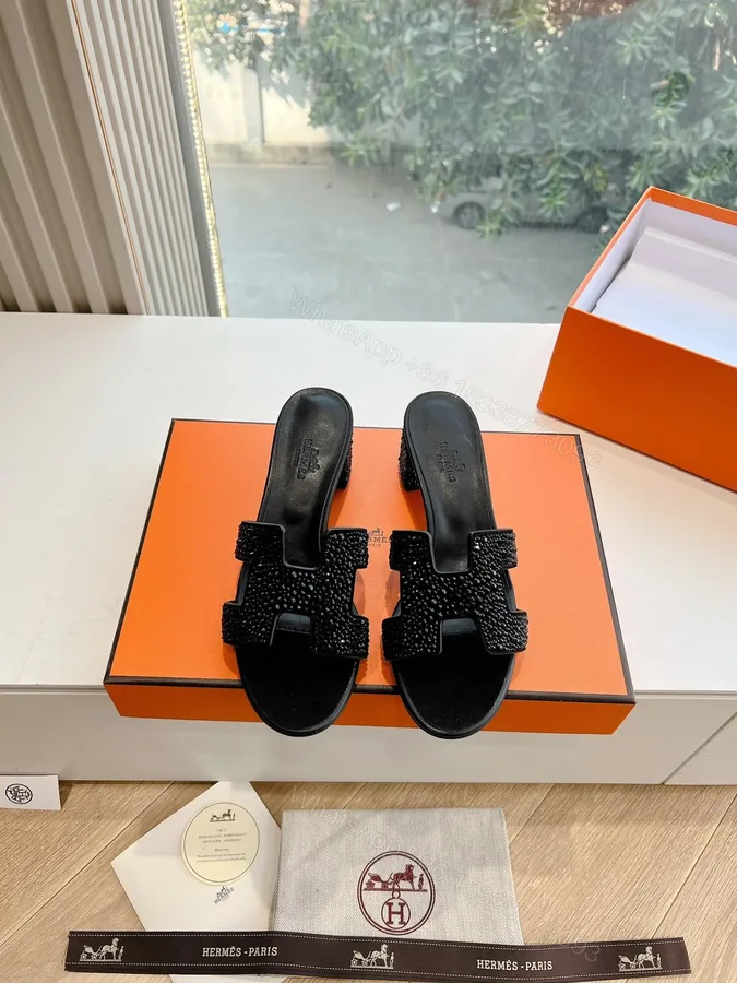 View 1 of Hermes Women Black Embellished Leather Mules