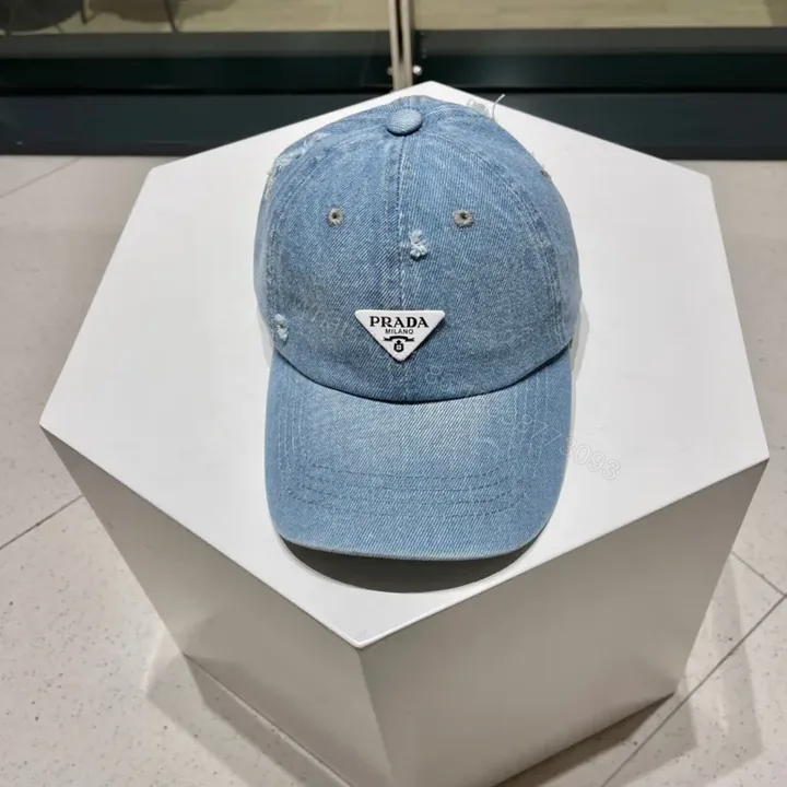 View 1 of Prada Denim Cap: Subtle Luxury Everyday Style