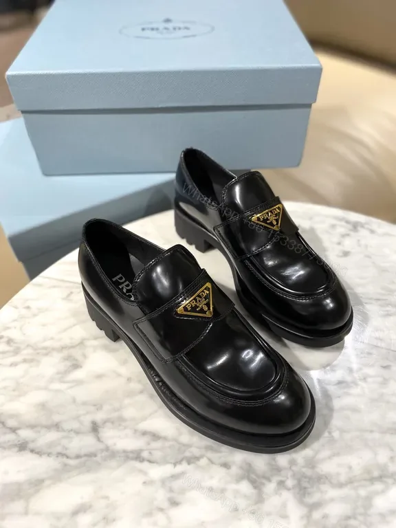 View 1 of Prada Black Calf-Leather Lug-Sole Loafers