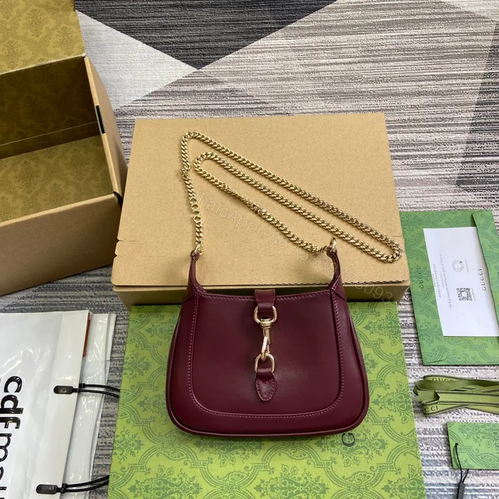View 1 of JACKIE NOTTE MINI BAG 19 IN BURGUNDY RED CALFSKIN GOLD HARDWARE