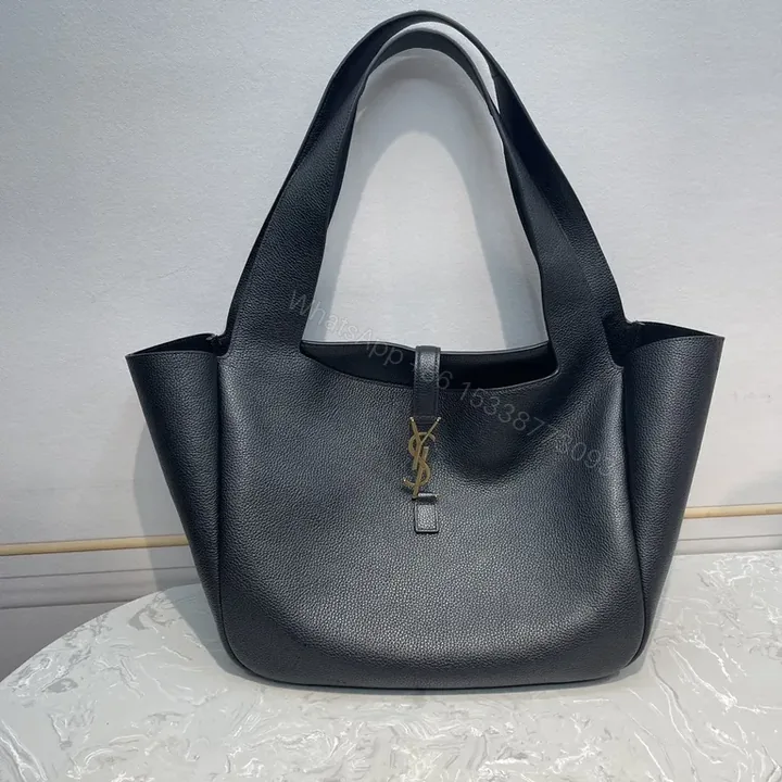 View 1 of Refined Black Leather Tote - Gold YSL Charm, Everyday Luxury Tote