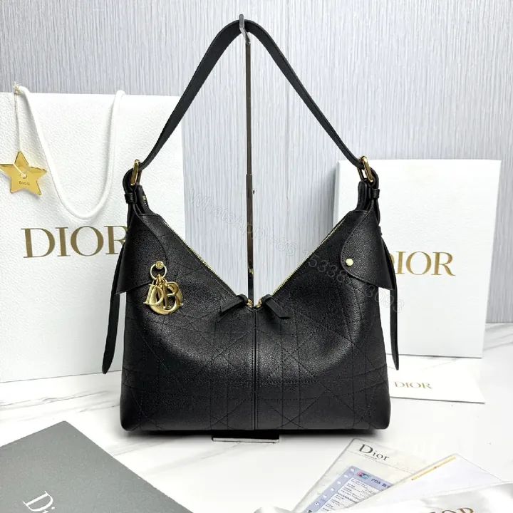 View 1 of Chic Black Leather Hobo Bag with Gold Charms