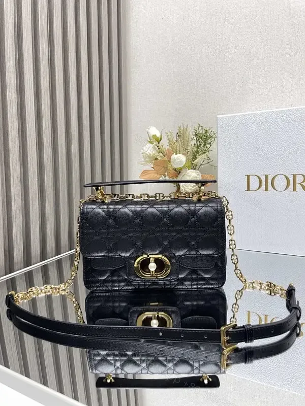 View 1 of Quilted Black Crossbody with Gold Chain: Modern Luxury Bag