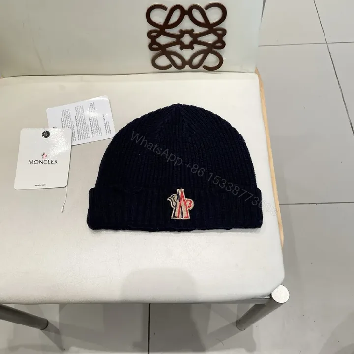View 1 of Navy Knit Beanie + Lux Embroidered Moncler Emblem
