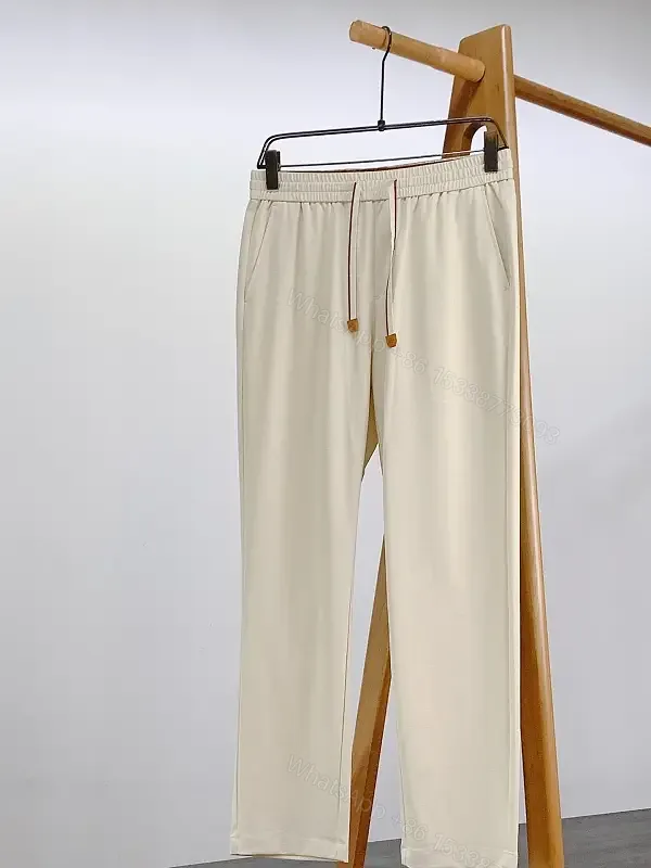 View 1 of Light Beige Drawstring Relaxed Pants with Elastic Waist, Smooth Solid Fabric, Full-Length Straight-Leg