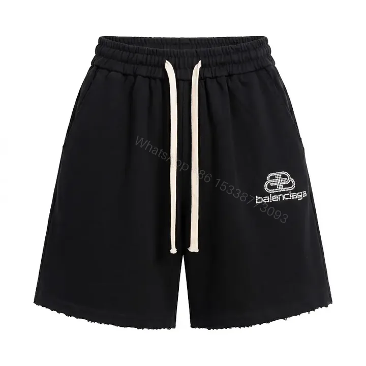View 1 of Black Cotton Drawstring Shorts - Balenciaga Logo Design