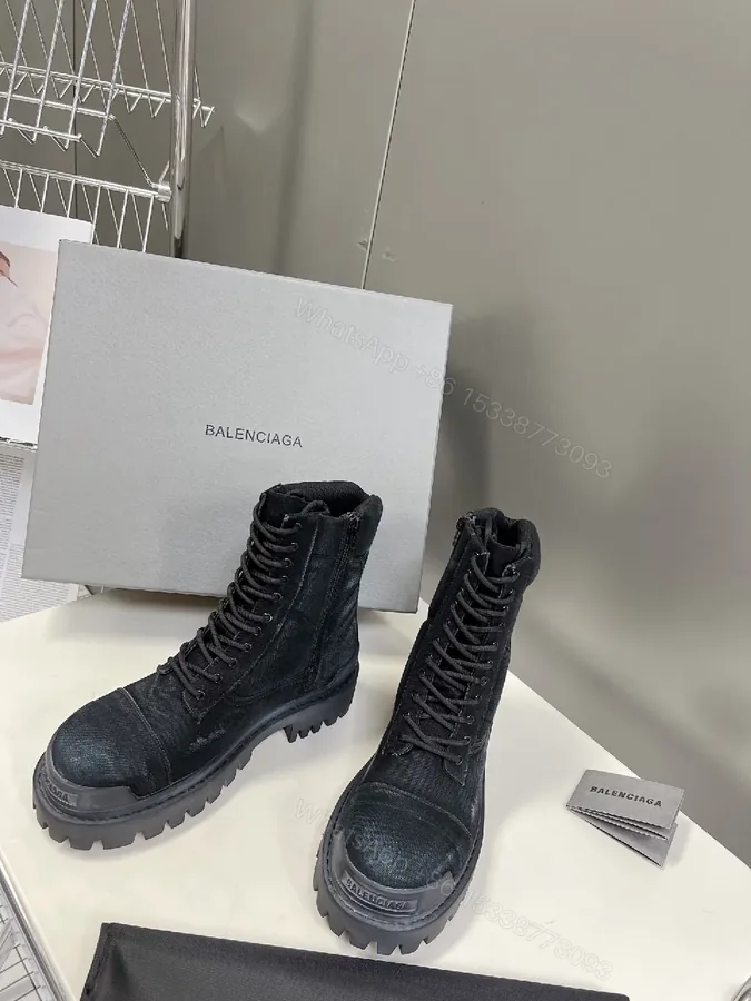 View 1 of Bold Black Combat Boots with Rugged Texture